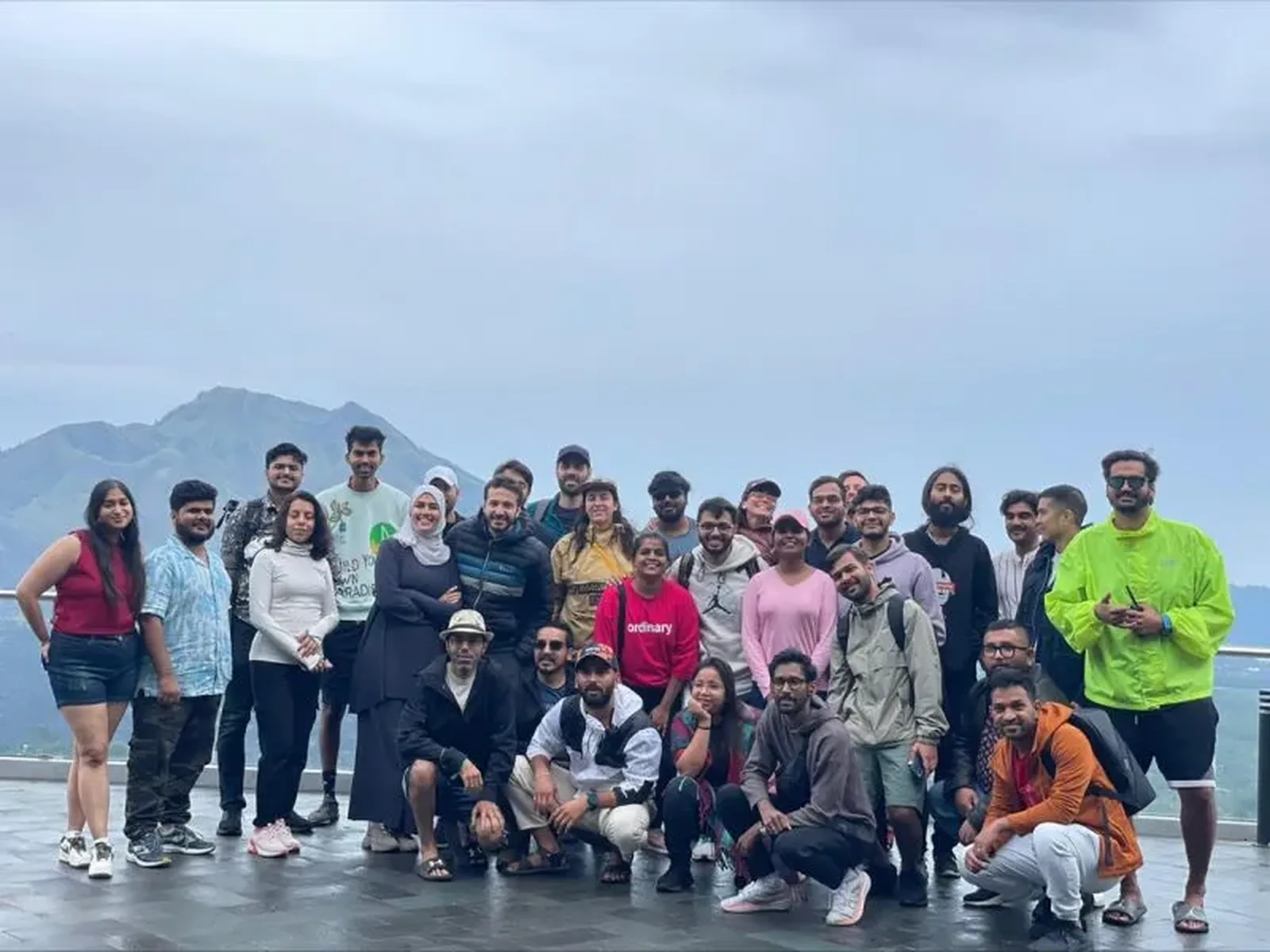 A company team on a Zubilant offsite, gathered on a hillside at the end of the day.